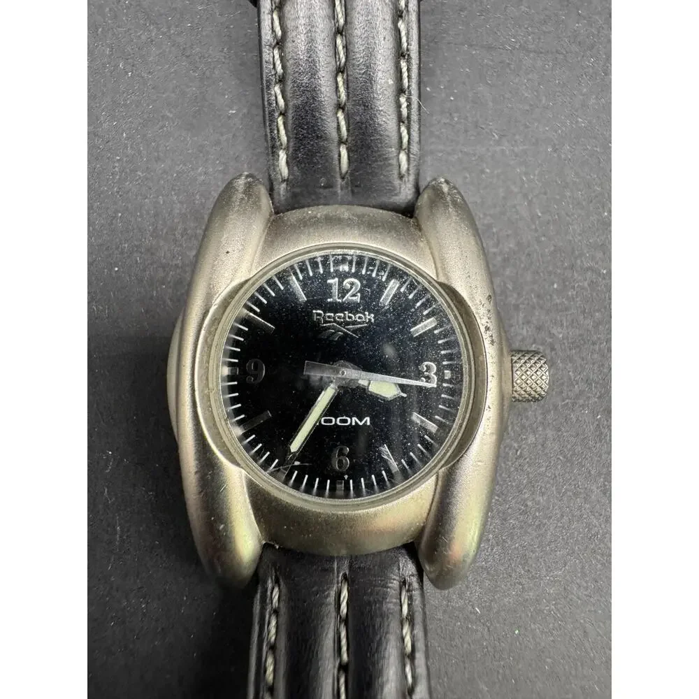 REEBOK Women's 100M Silver Tone Watch Black Leather Band Stainless Steel Back